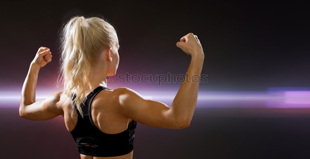 Similar – Close up side view profile portrait of one young athletic woman shadow boxing in sportswear in gym over dark background, looking away