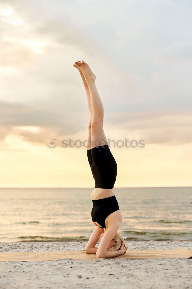 Similar – Caucasian blonde woman practicing yoga in the beach