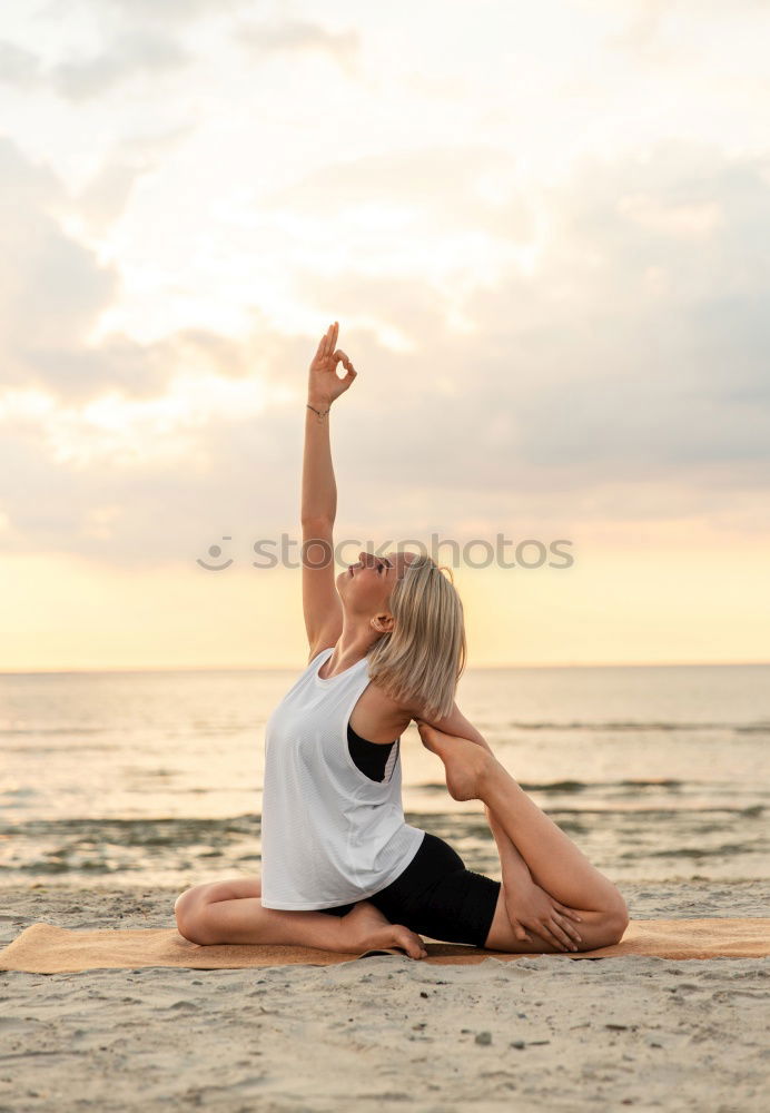 Similar – Caucasian blonde woman practicing yoga in the beach