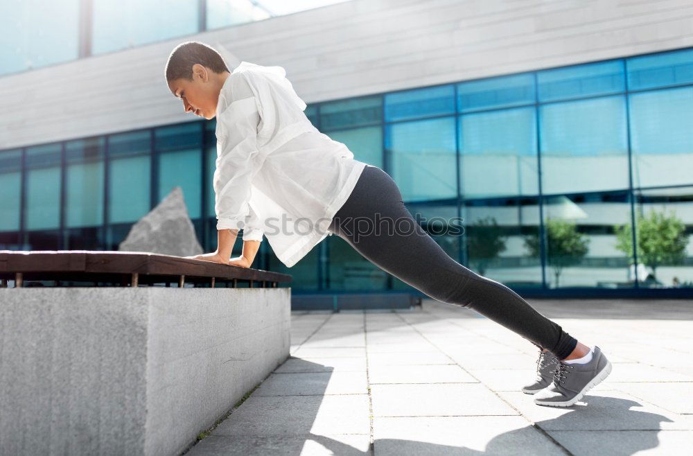 Similar – woman runner stretching outdoors