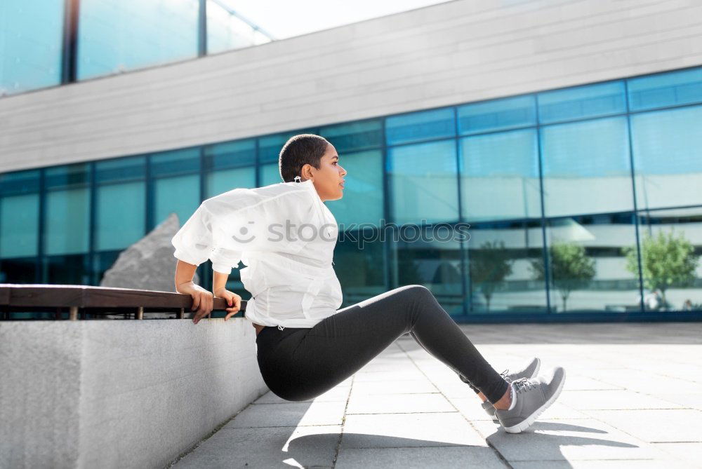 Similar – woman runner stretching outdoors