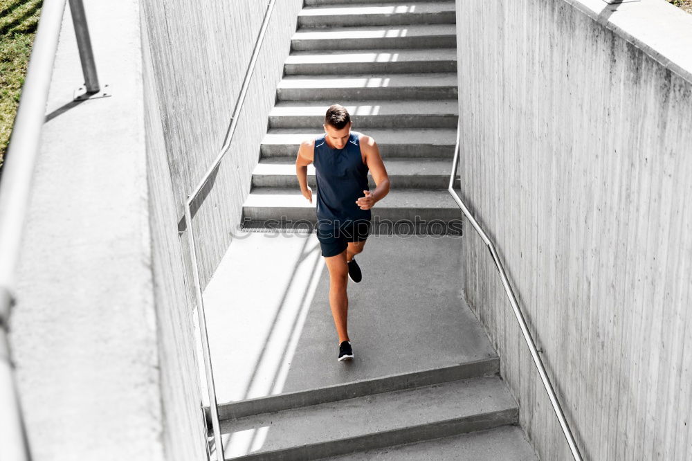 Similar – Two sportsmen running up stairs