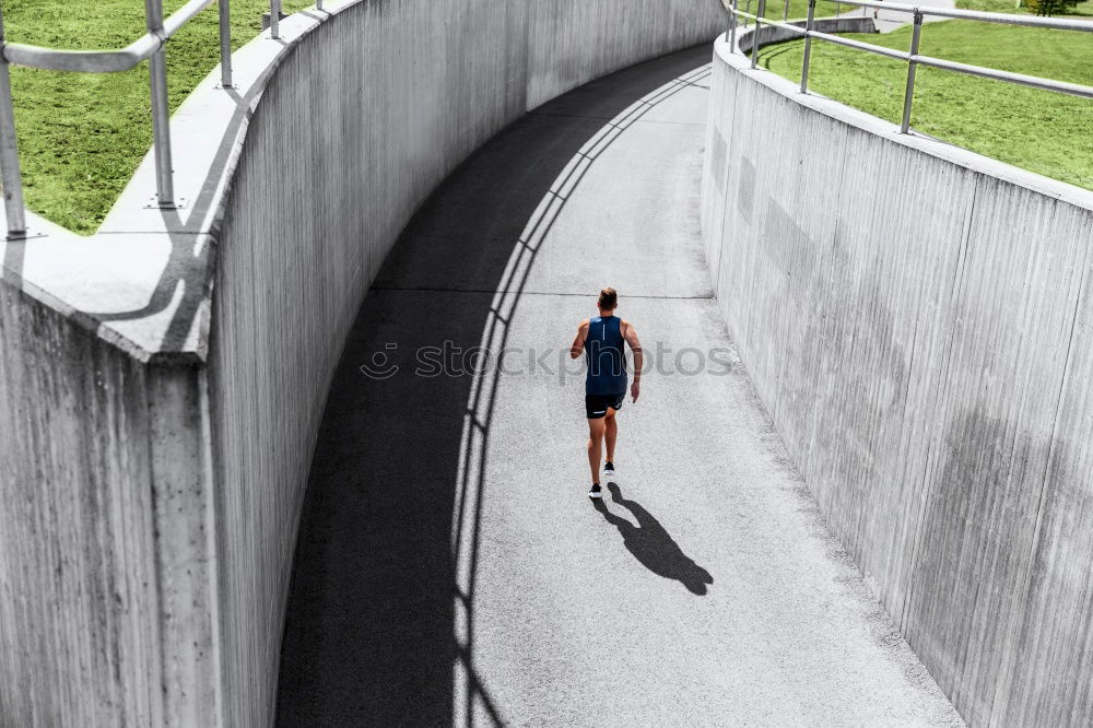 Similar – Foto Bild Ein Mann läuft eine grüne Linie Spur entlang