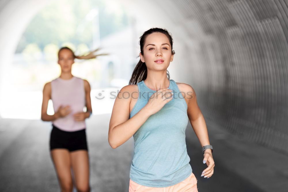 Athletic Women Drinking Water After an Exercise