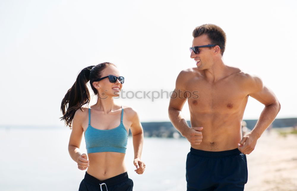 Similar – Close-up of young adult’s muscular bodies on the beach