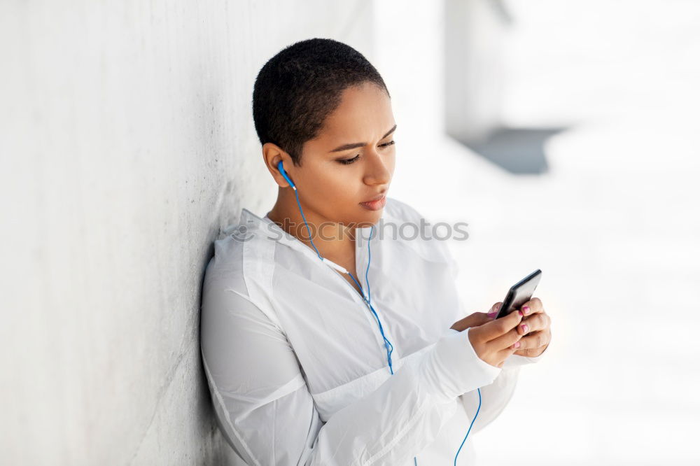 Similar – Black woman listening to the music with headphones