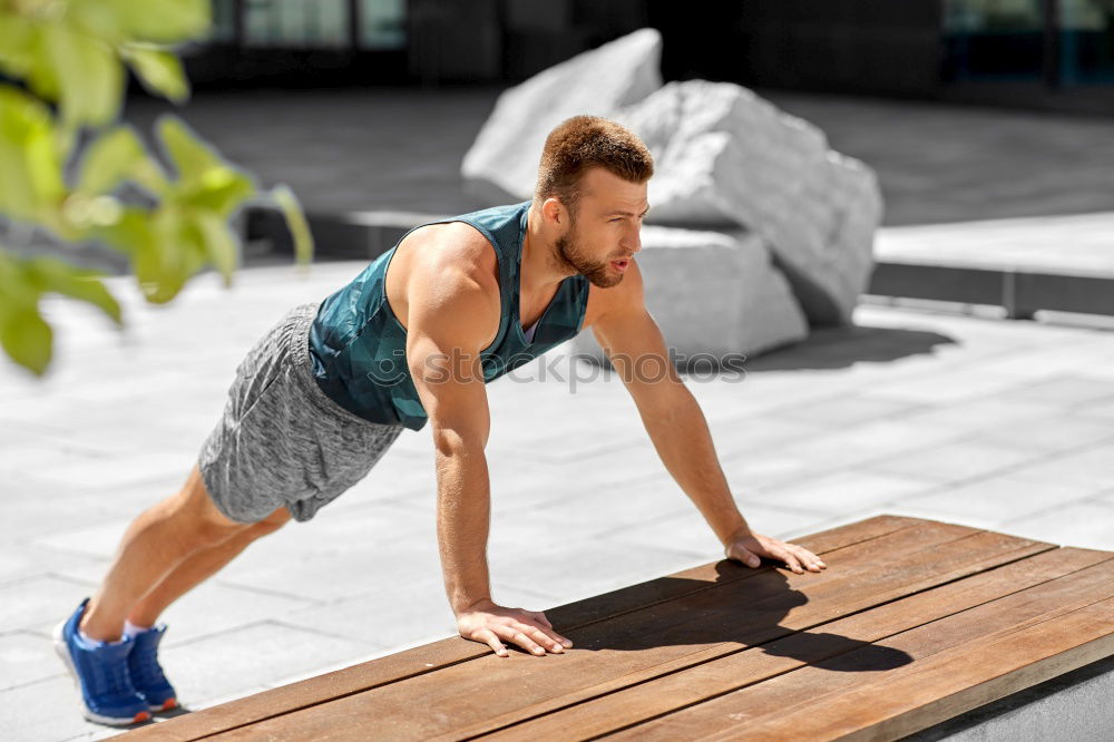 Similar – Image, Stock Photo Young man working out doing push-ups on a wooden park bench