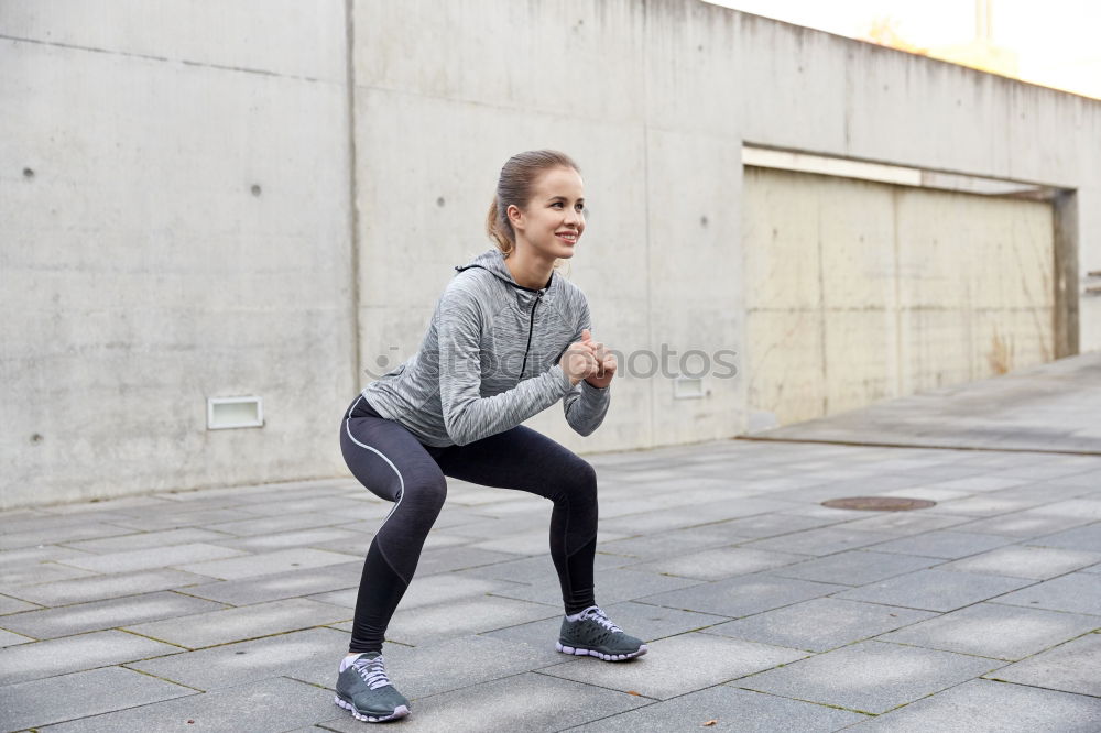 Similar – Smiling fit young woman doing stretching exercises