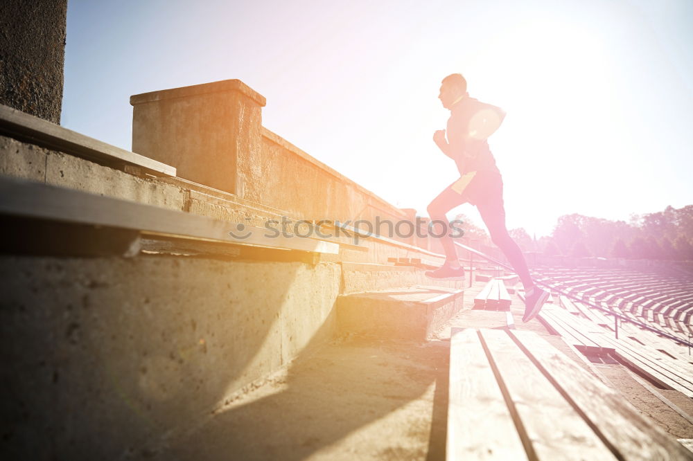 Similar – Young fitness woman runner running on city bridge.