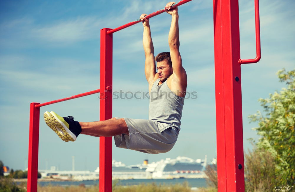 Similar – Young man stretching a resistance rubber band before calisthenics training