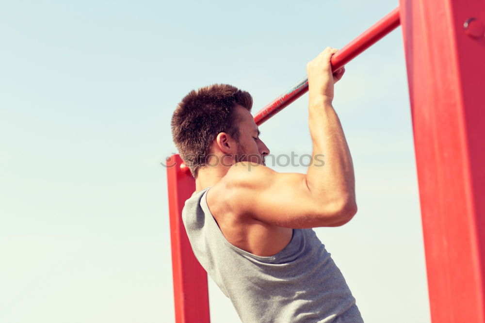 Similar – Young man stretching a resistance rubber band before calisthenics training