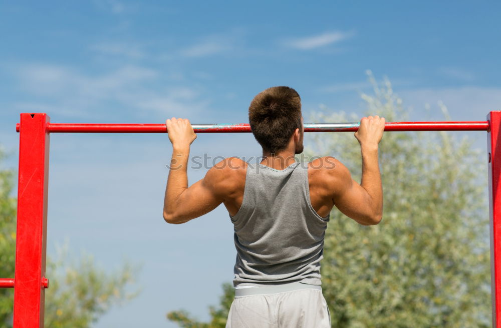 Similar – Young man stretching a resistance rubber band before calisthenics training