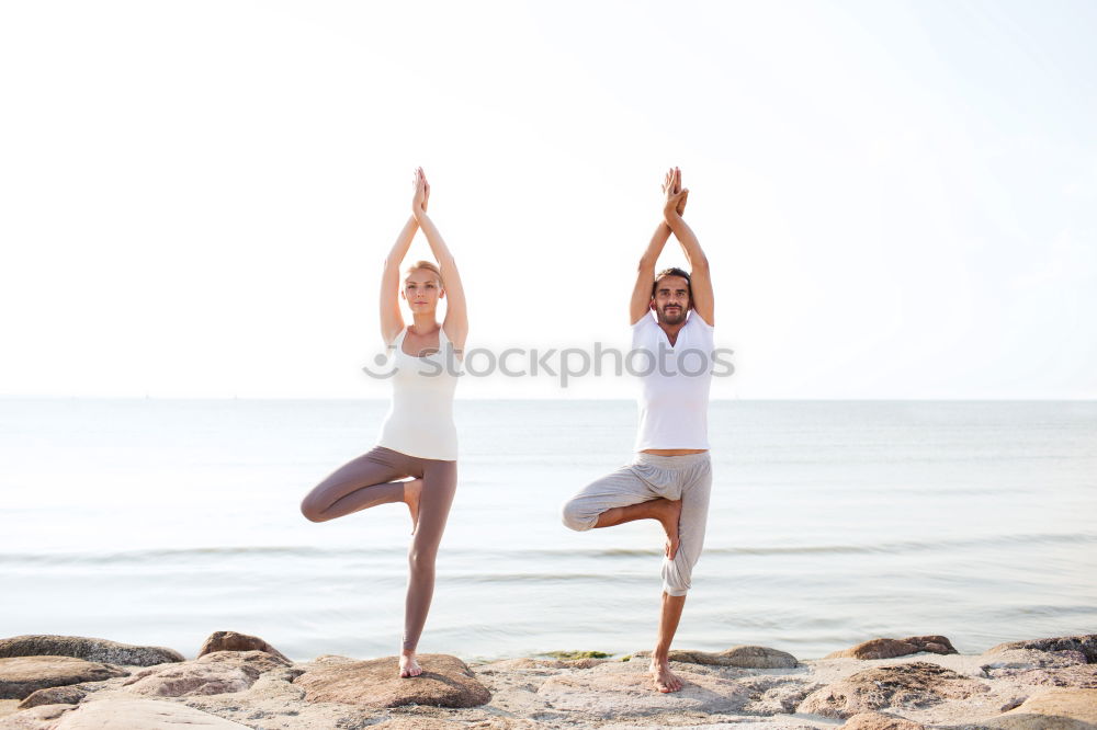 Similar – Image, Stock Photo Mother and daughter doing yoga exercises on the beach.