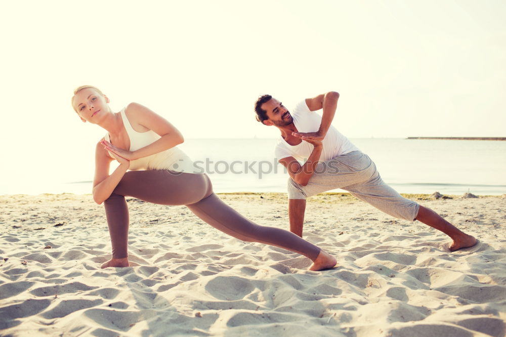 Similar – Adult fitness couple doing exercise together on beach