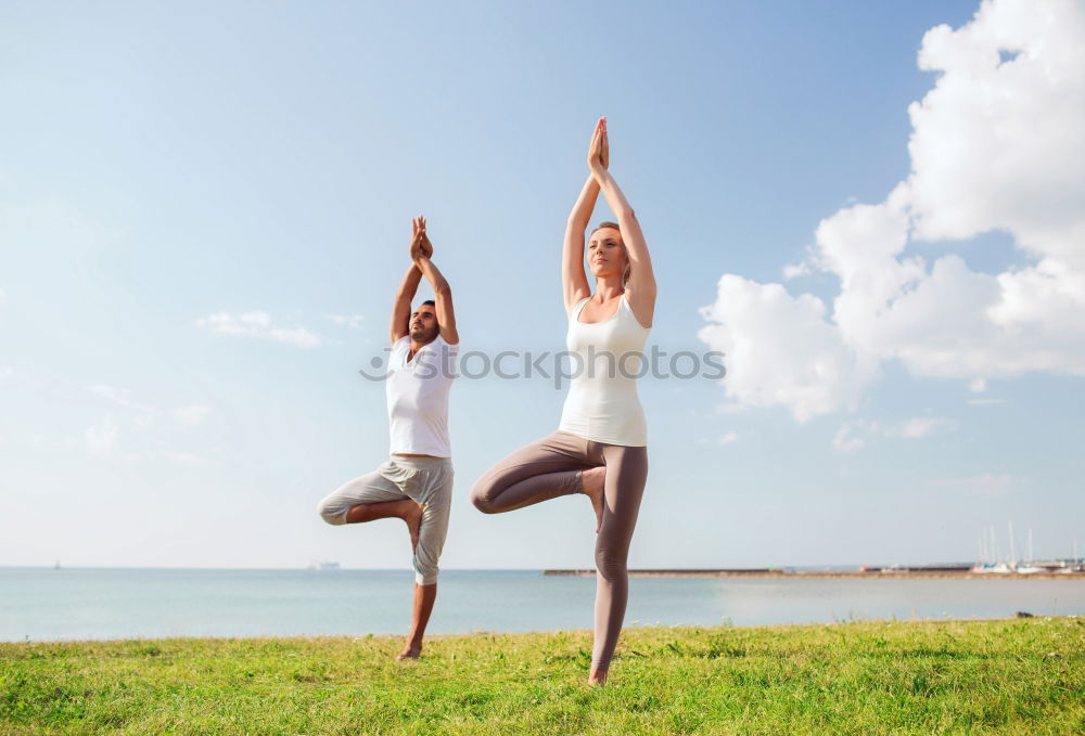 Similar – Image, Stock Photo Mother and daughter doing yoga exercises on the beach.