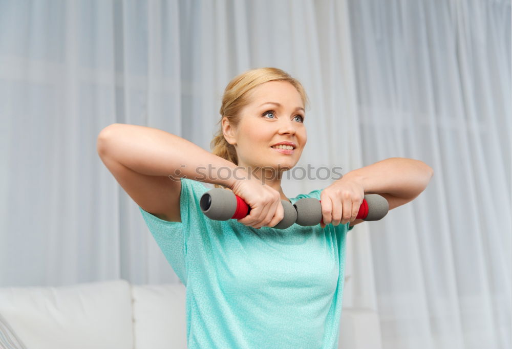 Similar – Woman doing exercises in aerobic class with a group on a fitness center