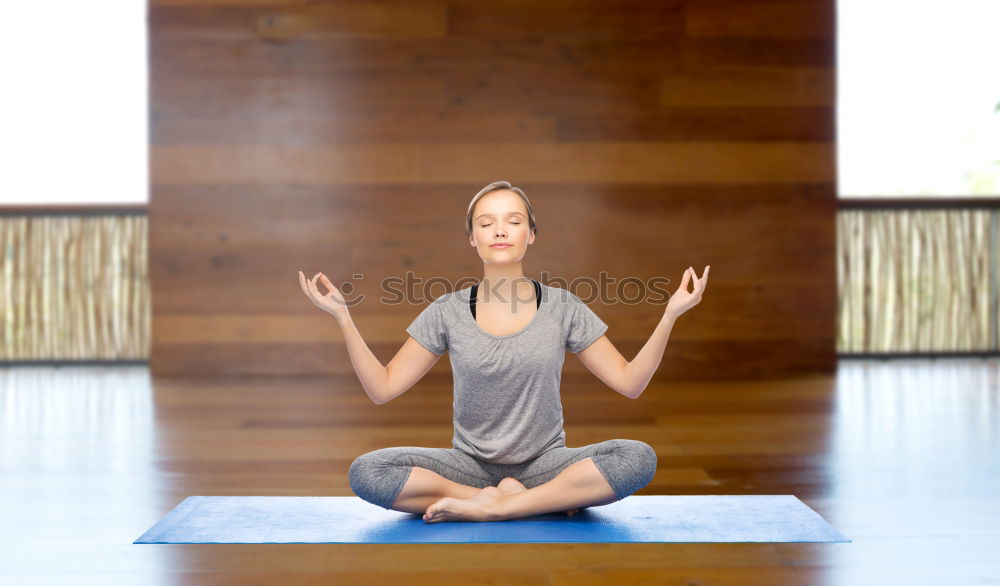 Similar – Young woman doing yoga in nature. Lotus figure.