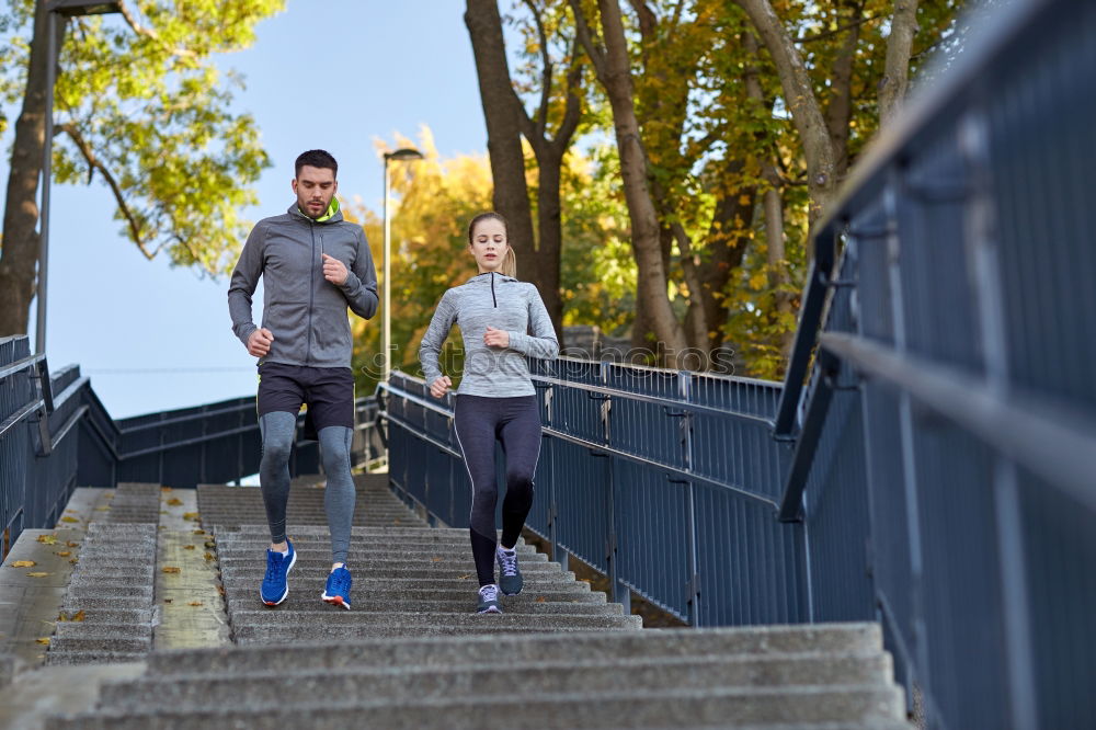 Similar – Image, Stock Photo Young couple running on a seafront promenade