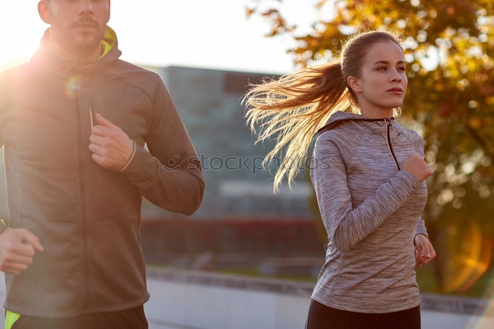 Similar – Image, Stock Photo Young couple running on a seafront promenade