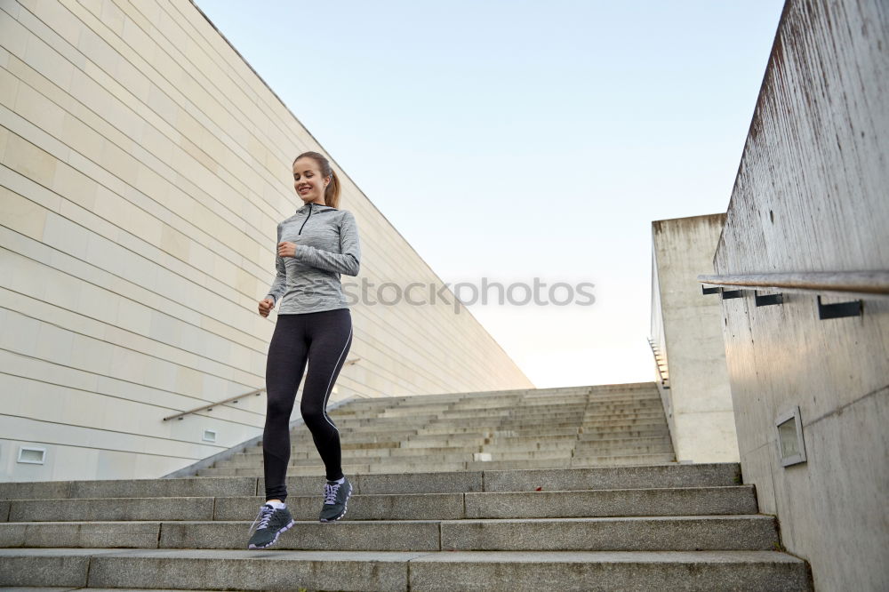 Similar – Woman stretching her body in front of ancient wall in park