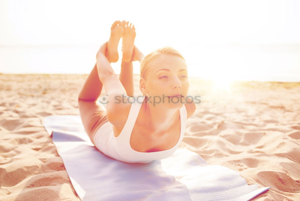 Similar – Caucasian blonde woman practicing yoga in the beach