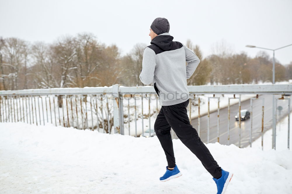 Similar – Man jogging in winter clothing