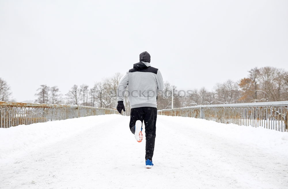 Similar – Man jogging in winter clothing