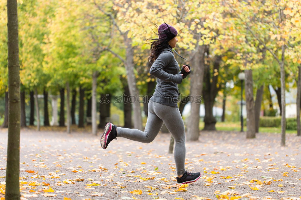 Athletic Woman in Running Exercise at the Park