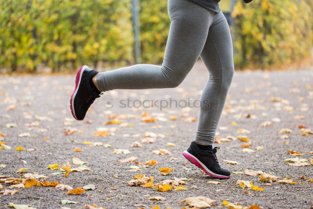 Similar – Fit middle-aged woman walking through a field