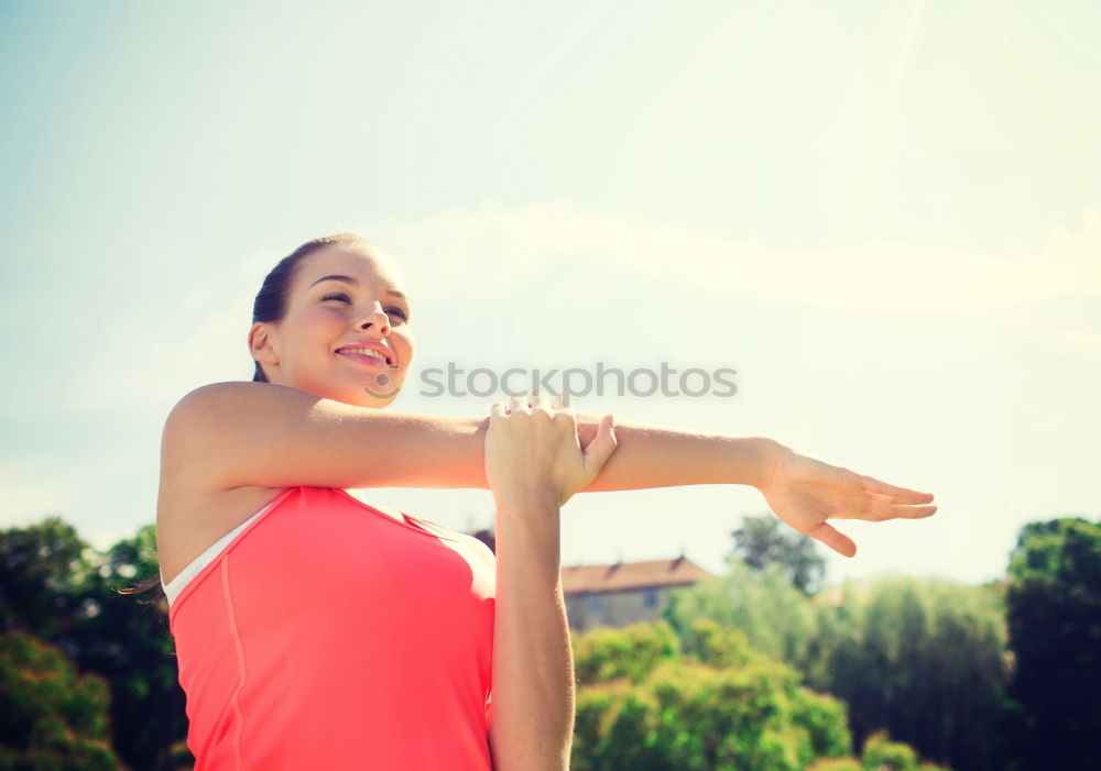 Similar – Woman tying hair in ponytail getting ready for run.