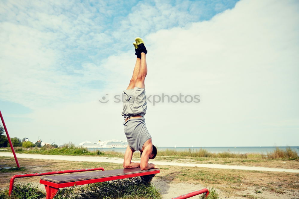 Similar – Image, Stock Photo Strong man exercising on bar near sea