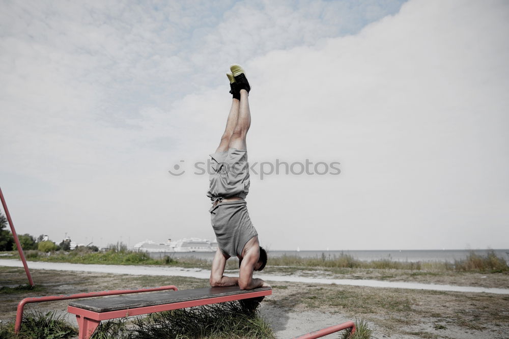 Similar – Man in obstacle course doing irish table