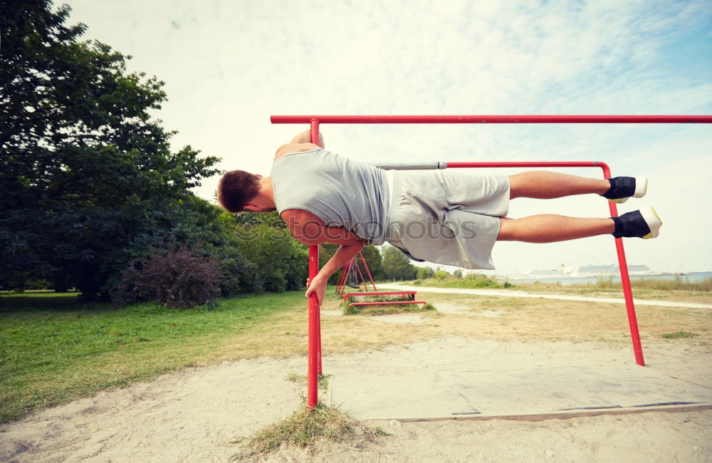 Similar – Man in obstacle course doing irish table