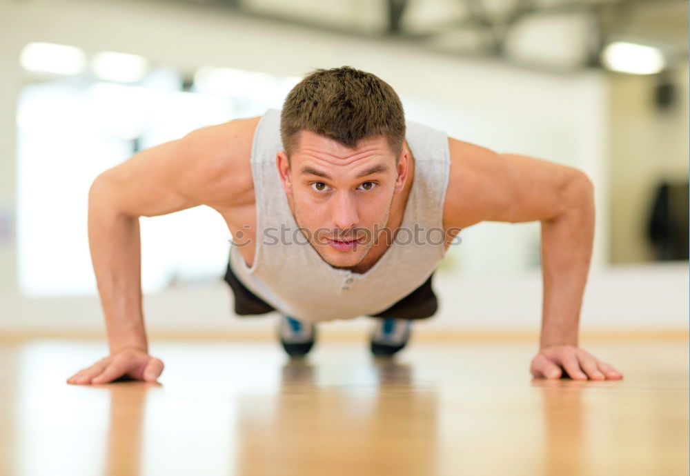 Similar – Attractive man doing pushups in the gym.