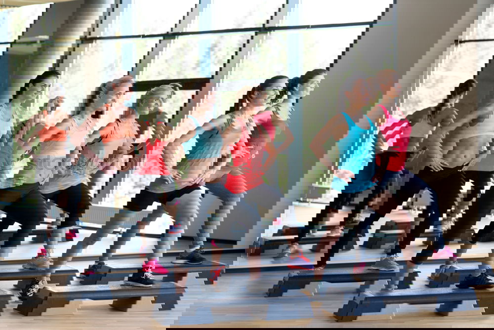 Similar – Image, Stock Photo Women group training over steppers in aerobic class
