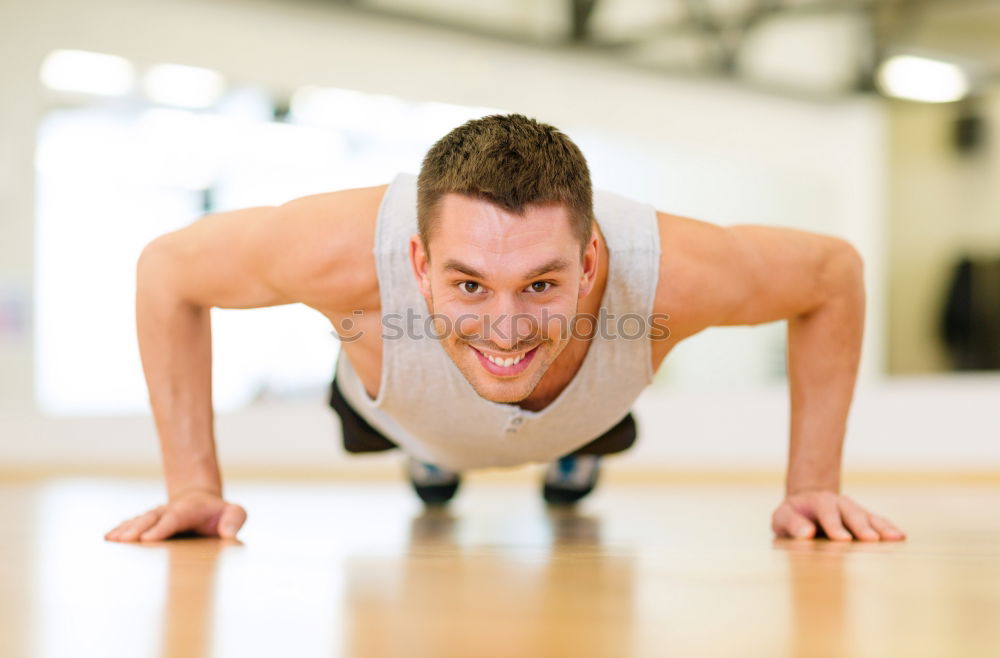 Similar – Attractive man doing pushups in the gym.