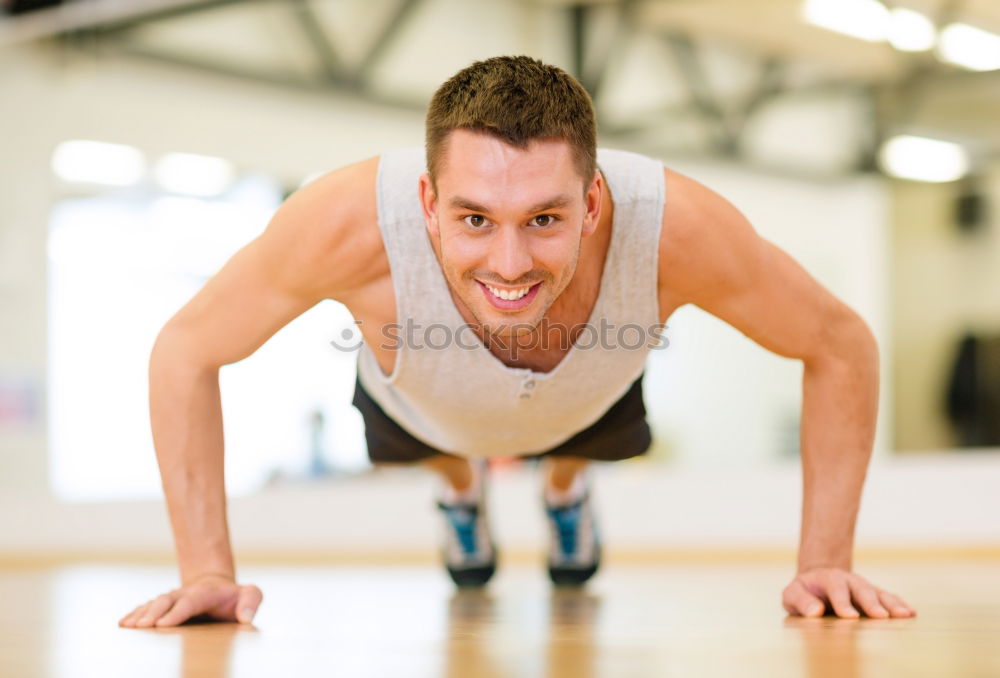 Similar – Attractive man doing pushups in the gym.