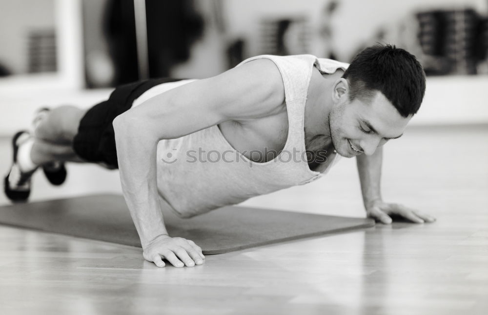 Similar – Attractive man doing pushups in the gym.