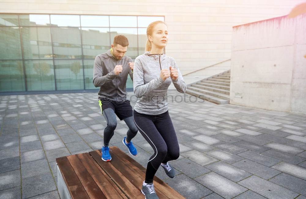 Similar – Young couple running on a seafront promenade