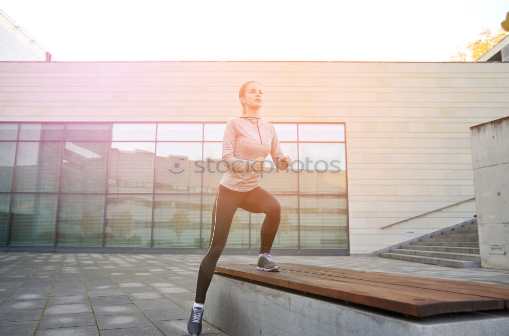 Similar – woman runner stretching outdoors