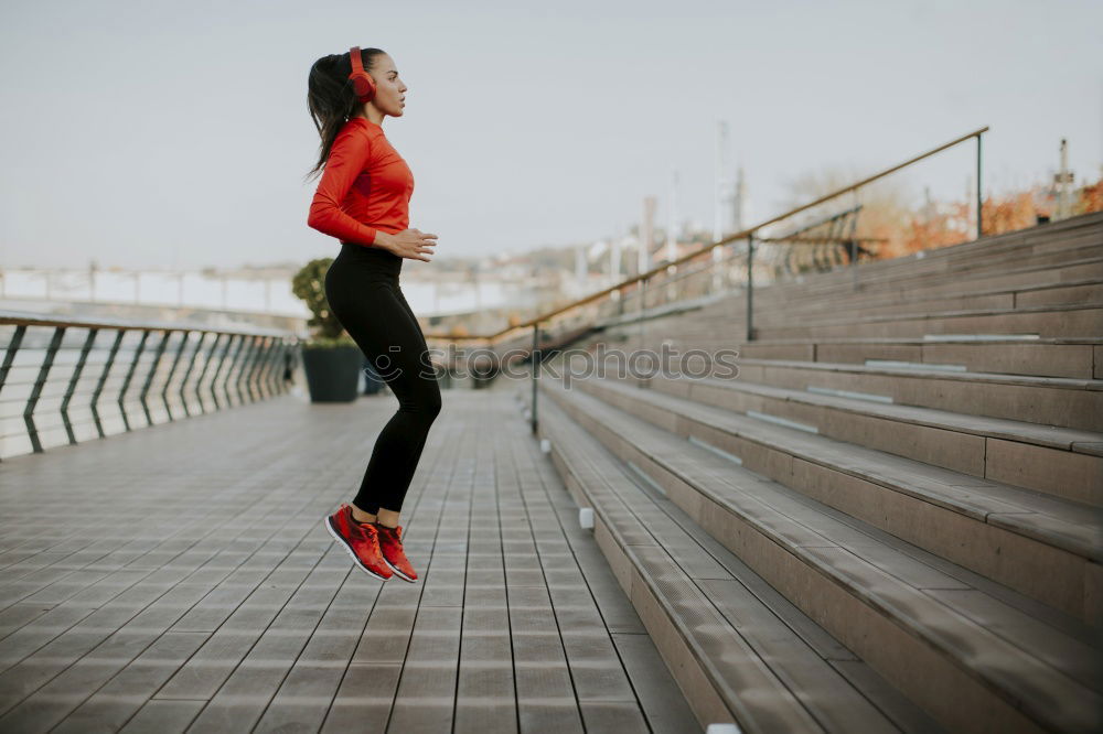 Similar – Young fitnesswoman runner stretching legs after run.