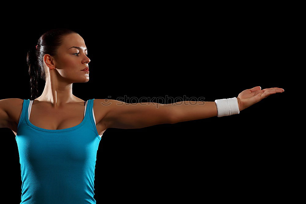 Similar – Close up side view profile portrait of one young athletic woman shadow boxing in sportswear in gym over dark background, looking away