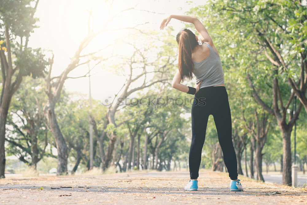 Similar – athletic woman doing her stretching routine