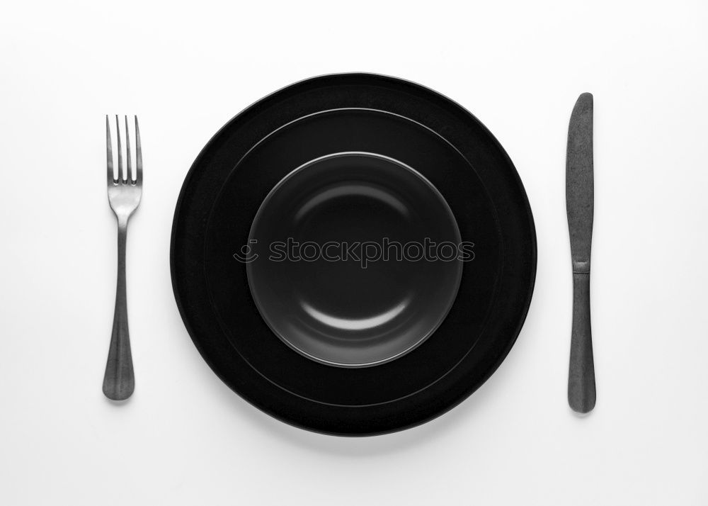 white square plate and iron cutlery