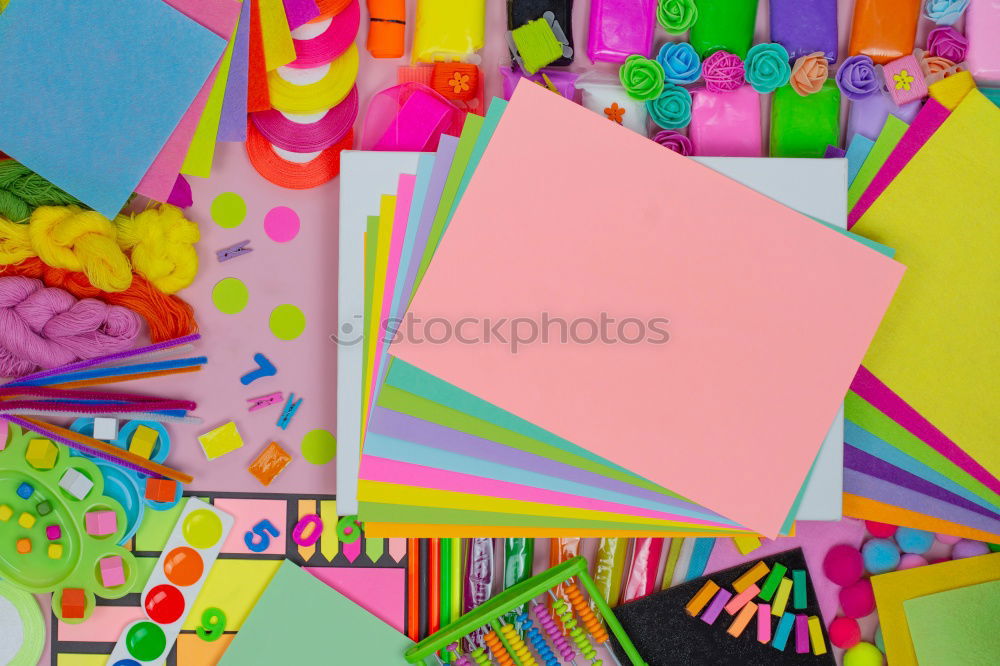 Similar – markers, crayons, pink and blue paper, scissors, eraser