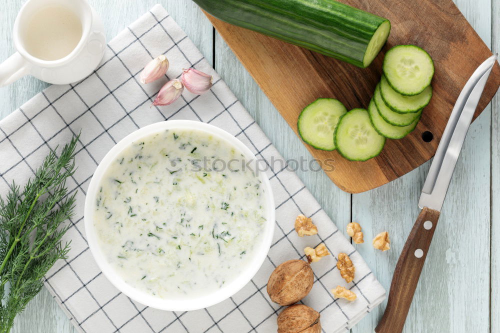 Similar – Spinach in cream sauce in a saucepan with spoon