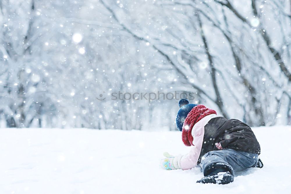 Mother and her daughter are spending time in winter