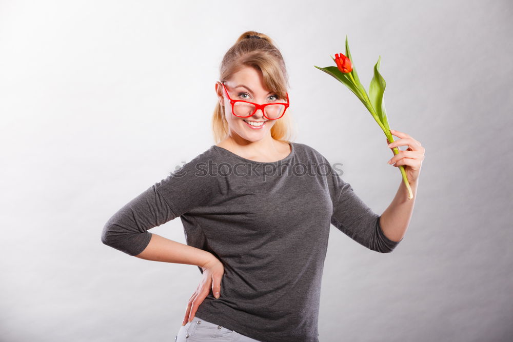 Young woman holding a red heart