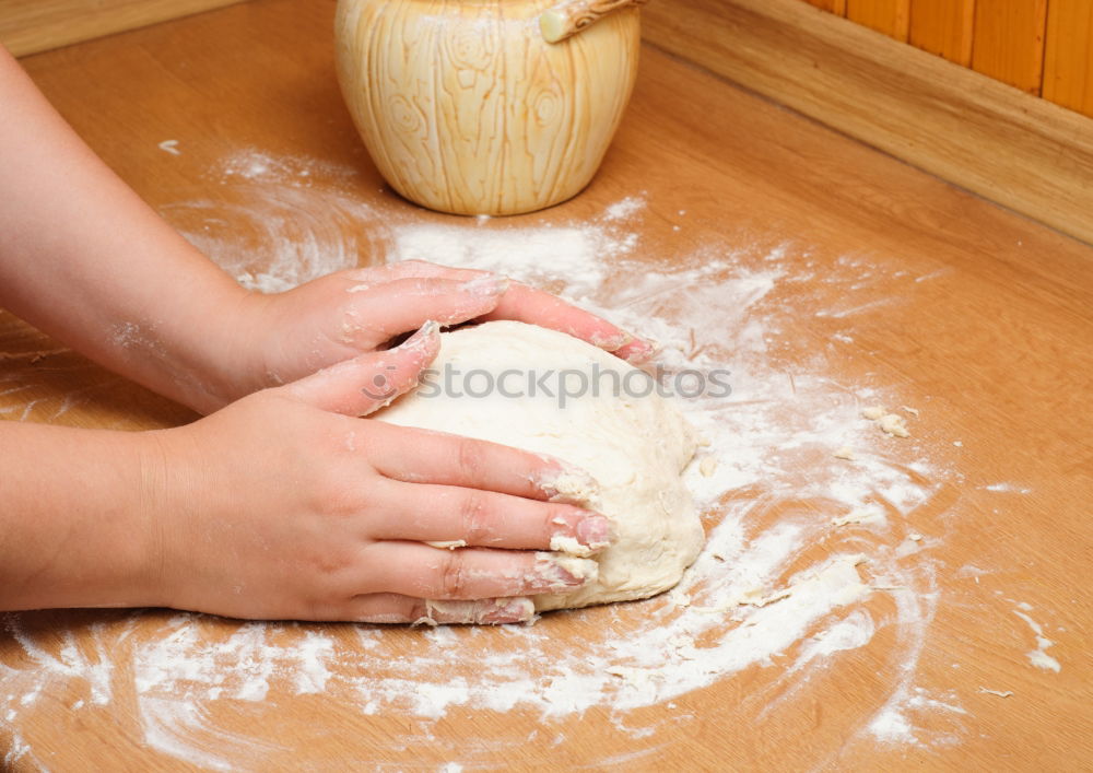 Similar – Woman kneading bread dough