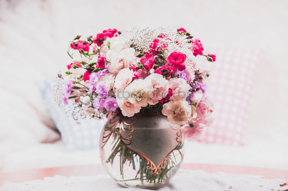 Similar – Ranunculus bundles in a glass vase